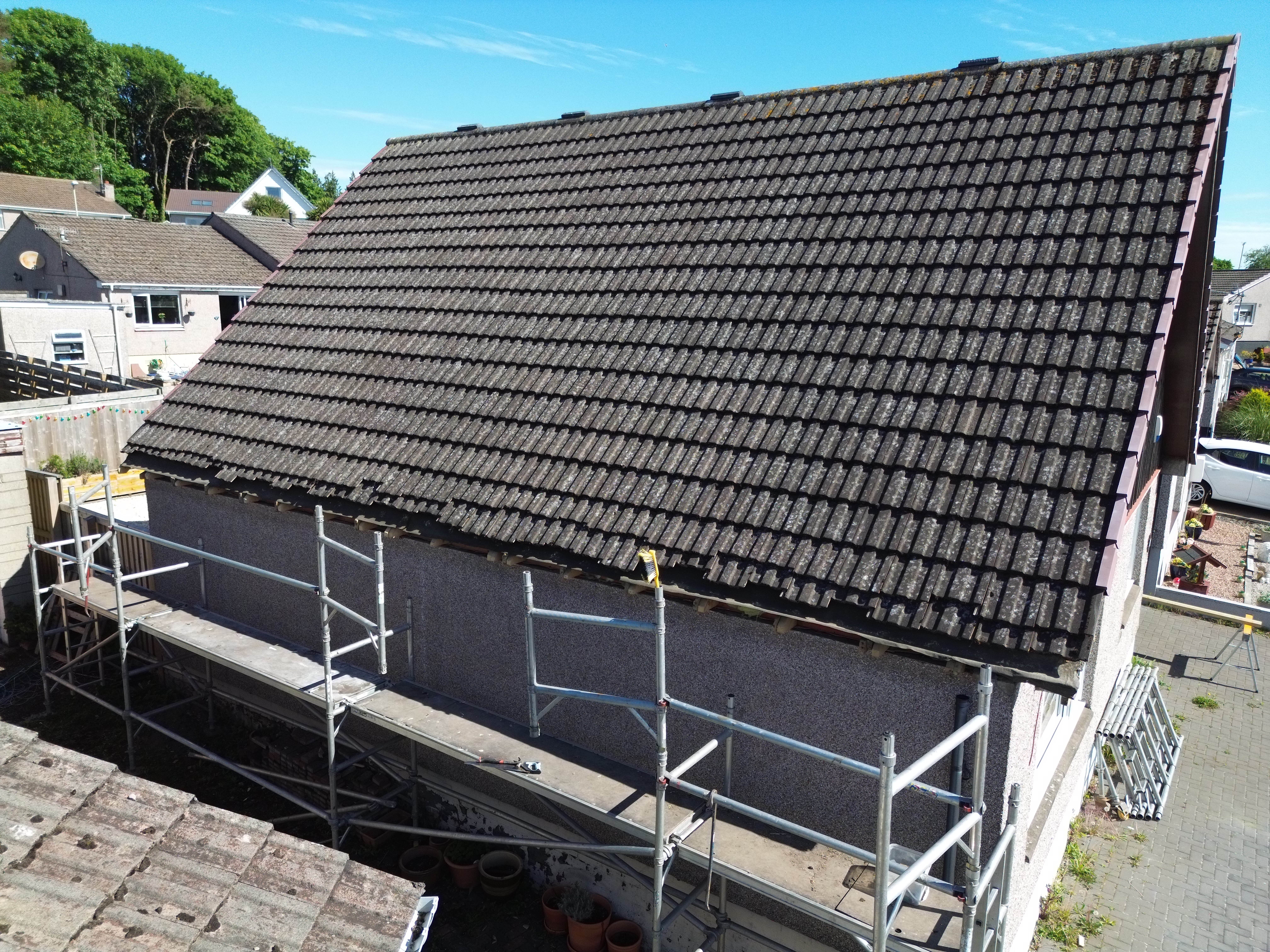 Stripped-back rafters during a roofline replacement